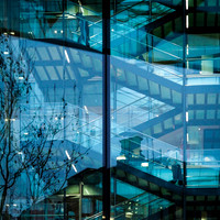 Behind glass